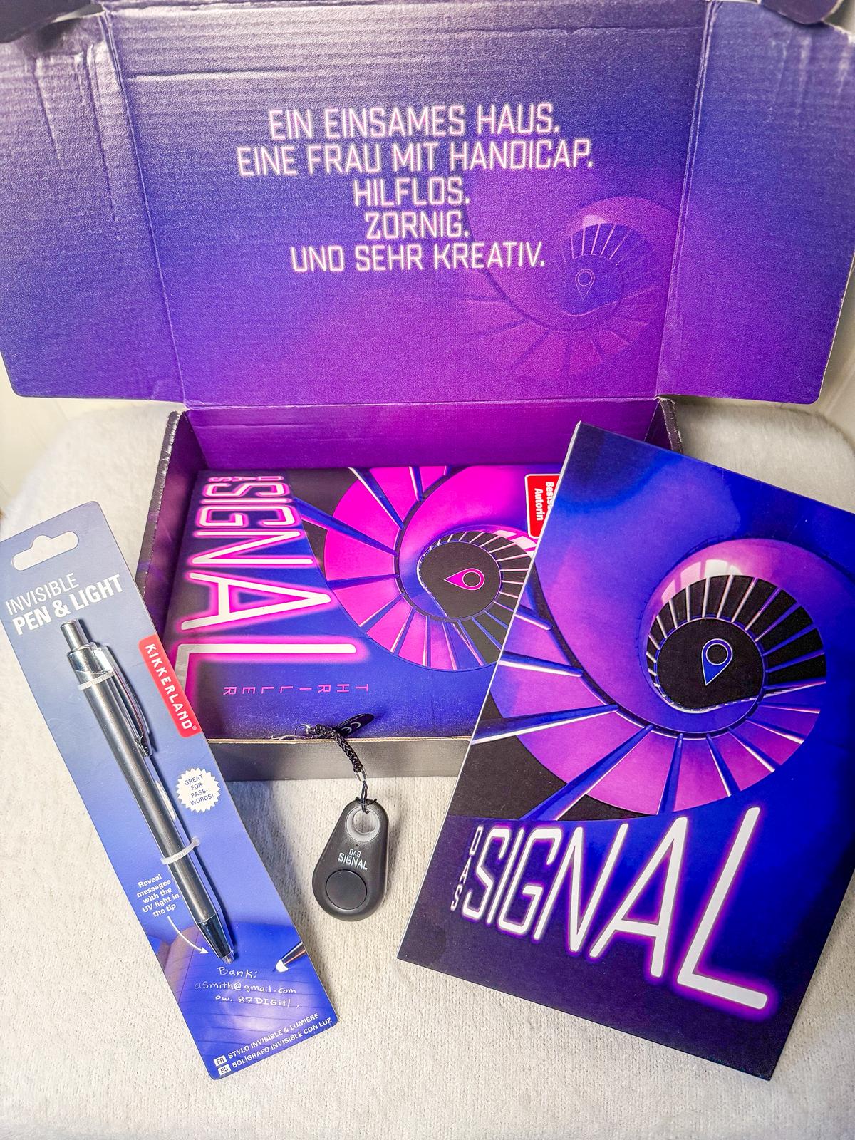 Bloggerbox zu Das Signal von Ursula Poznanski Bloggerbox zu Das Signal mit Buch und Zubehör von Droemer Knaur